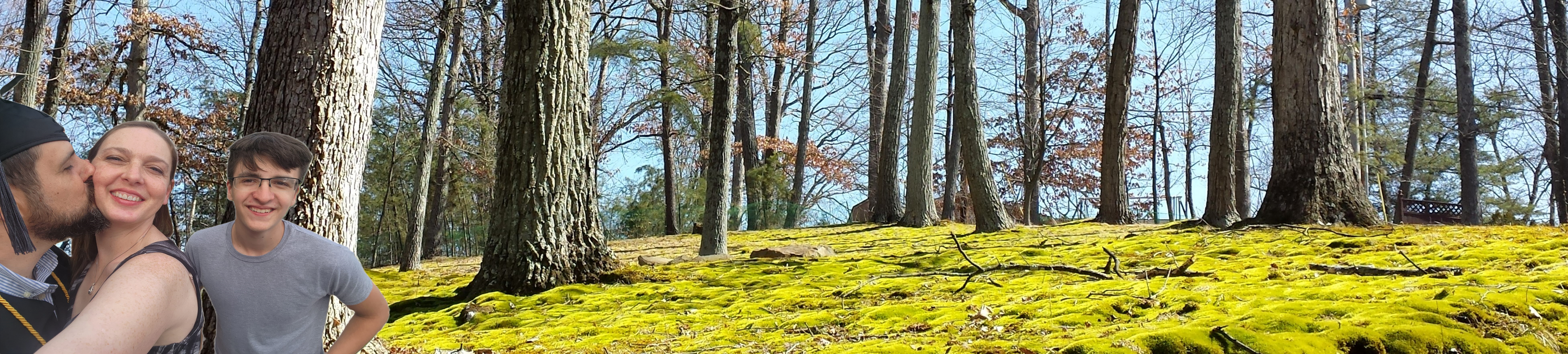 Image of us 3 with the woods in the background.